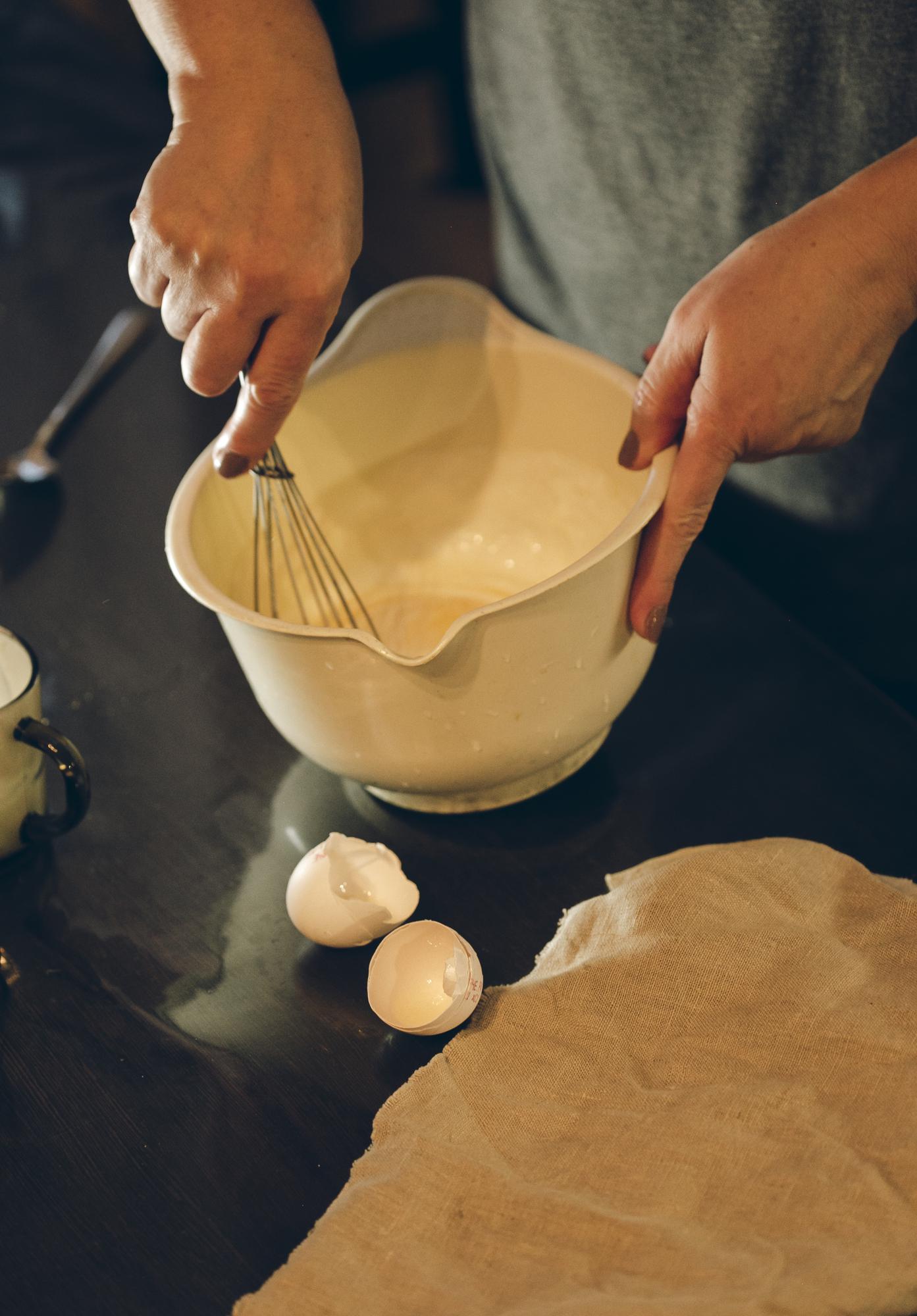 Hands preparing dough in bowl